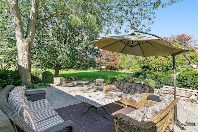 view of patio / terrace with an outdoor living space with a fire pit