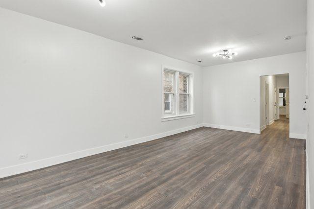 empty room featuring dark hardwood / wood-style floors