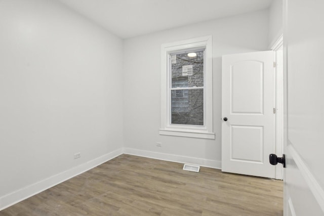 empty room featuring wood-type flooring