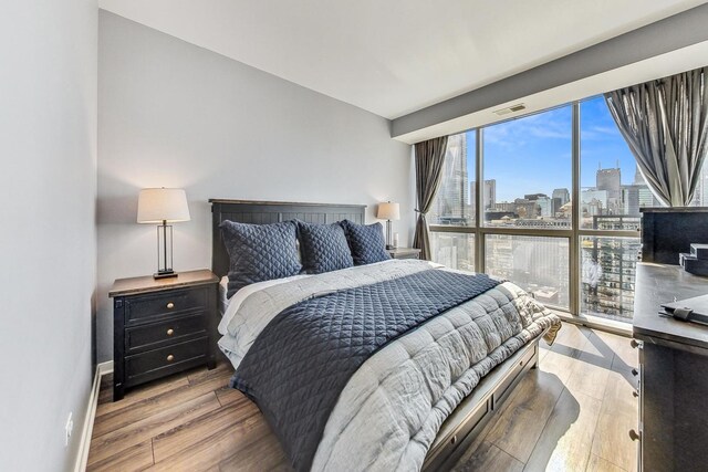 bedroom with light hardwood / wood-style flooring