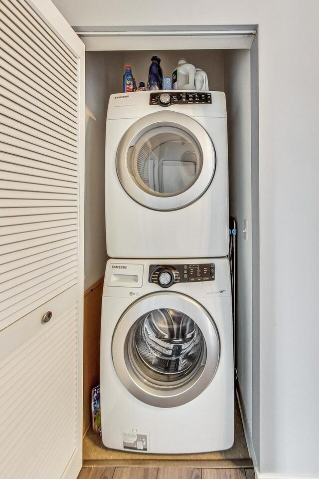 laundry area with stacked washer / drying machine