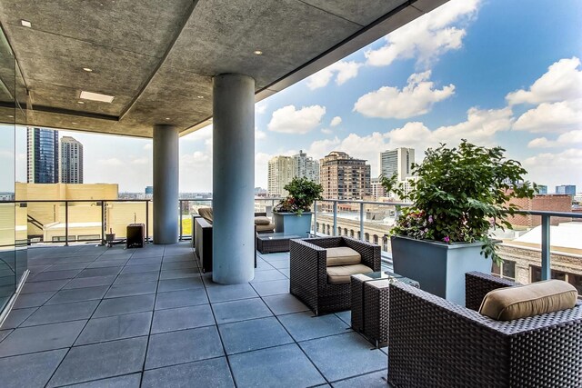 view of patio with a balcony and an outdoor hangout area