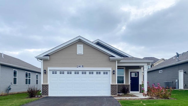 view of front of home with a garage and a front yard