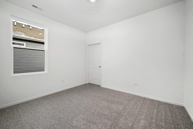 unfurnished room with carpet flooring