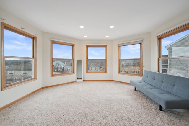 unfurnished room with recessed lighting, baseboards, and carpet floors