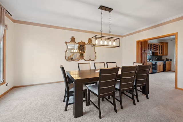 dining area with baseboards, light carpet, and ornamental molding