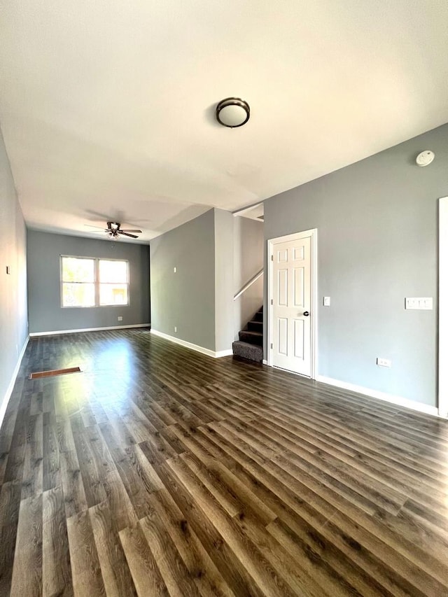 unfurnished room featuring ceiling fan and dark hardwood / wood-style floors