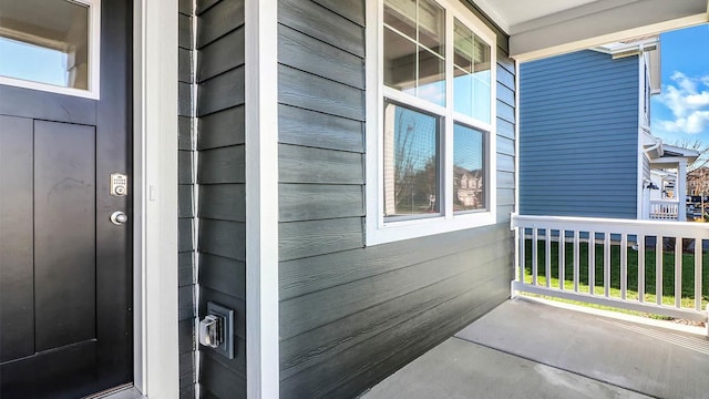 property entrance featuring covered porch