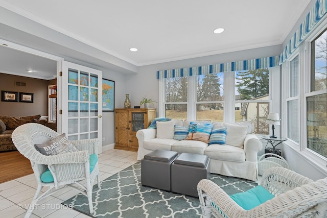 living room featuring visible vents, baseboards, recessed lighting, crown molding, and tile patterned floors