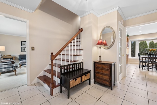 stairs with tile patterned floors, baseboards, and ornamental molding