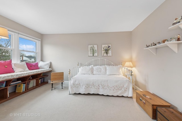 carpeted bedroom with baseboards