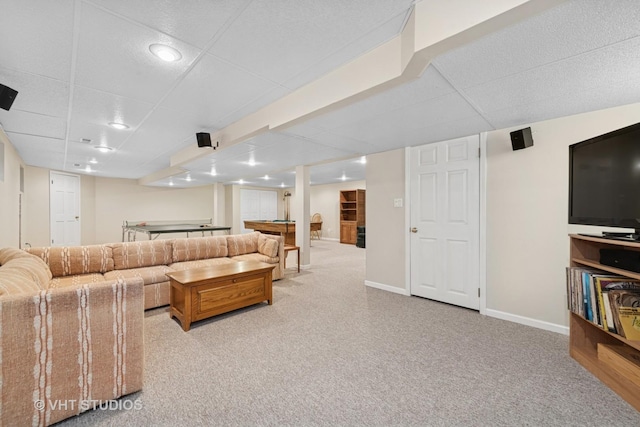 living room with a paneled ceiling, baseboards, carpet, and pool table