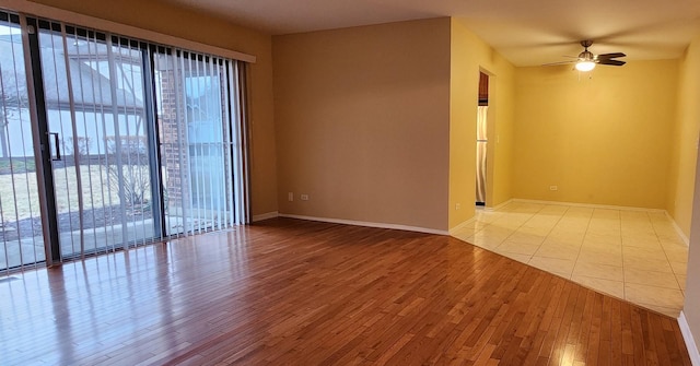 unfurnished room featuring light hardwood / wood-style flooring and ceiling fan