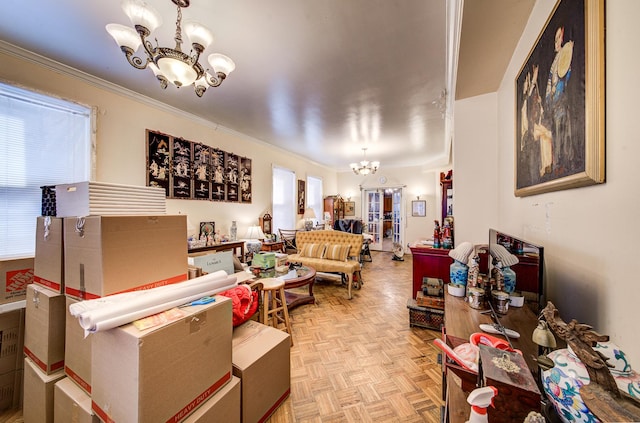 living room with light parquet flooring, crown molding, and an inviting chandelier