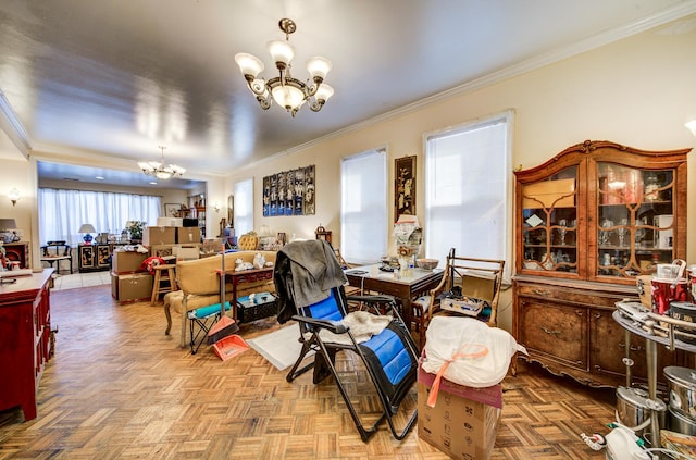 dining room featuring ornamental molding, light parquet flooring, and a chandelier