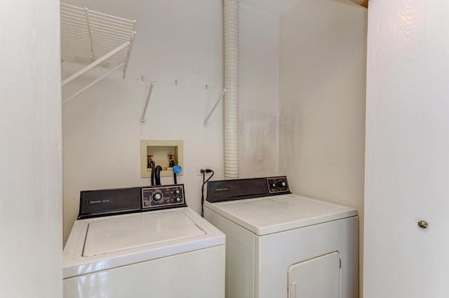 washroom with separate washer and dryer