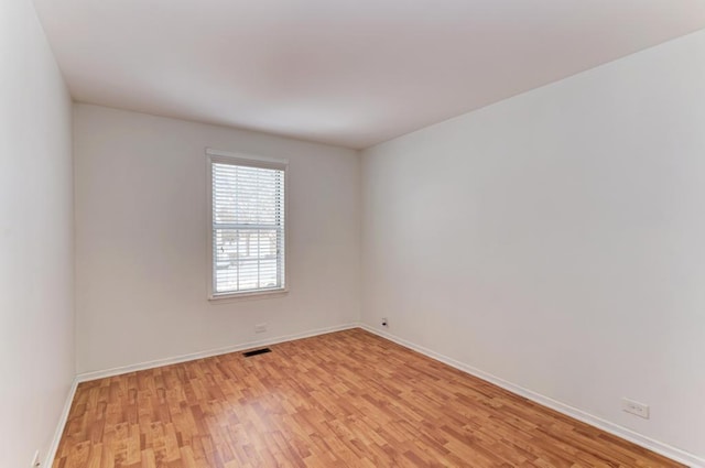 unfurnished room featuring light wood-type flooring