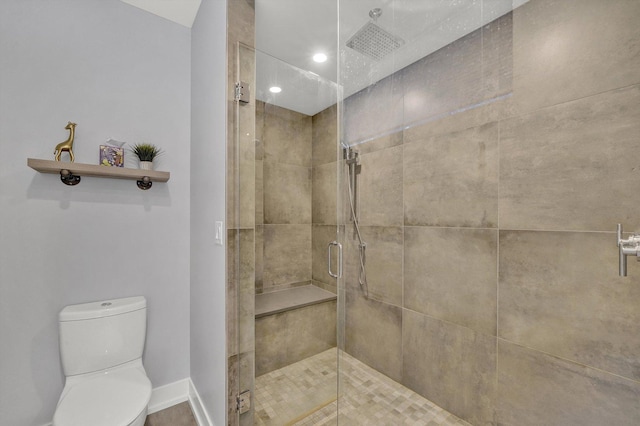 full bath featuring recessed lighting, baseboards, a shower stall, and toilet