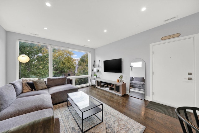 living room featuring visible vents, wood finished floors, and recessed lighting