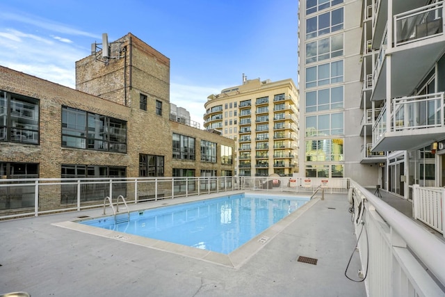 view of swimming pool with a patio area