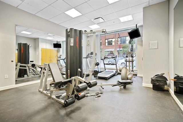 workout area featuring a drop ceiling