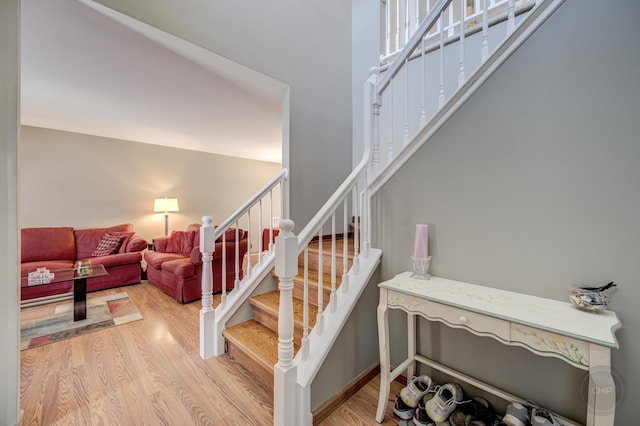 staircase featuring wood-type flooring