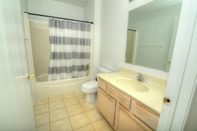 full bath with toilet, shower / bath combo with shower curtain, tile patterned flooring, and vanity