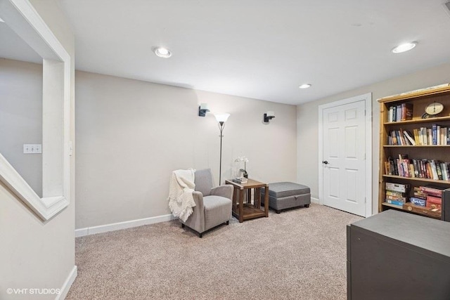 sitting room featuring carpet floors, recessed lighting, and baseboards