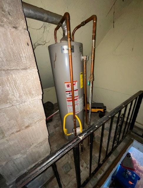 utility room featuring gas water heater