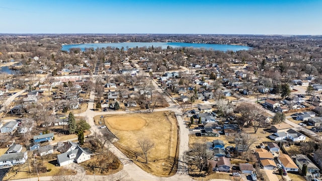 bird's eye view with a residential view and a water view