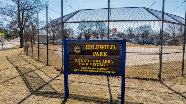 view of community with fence