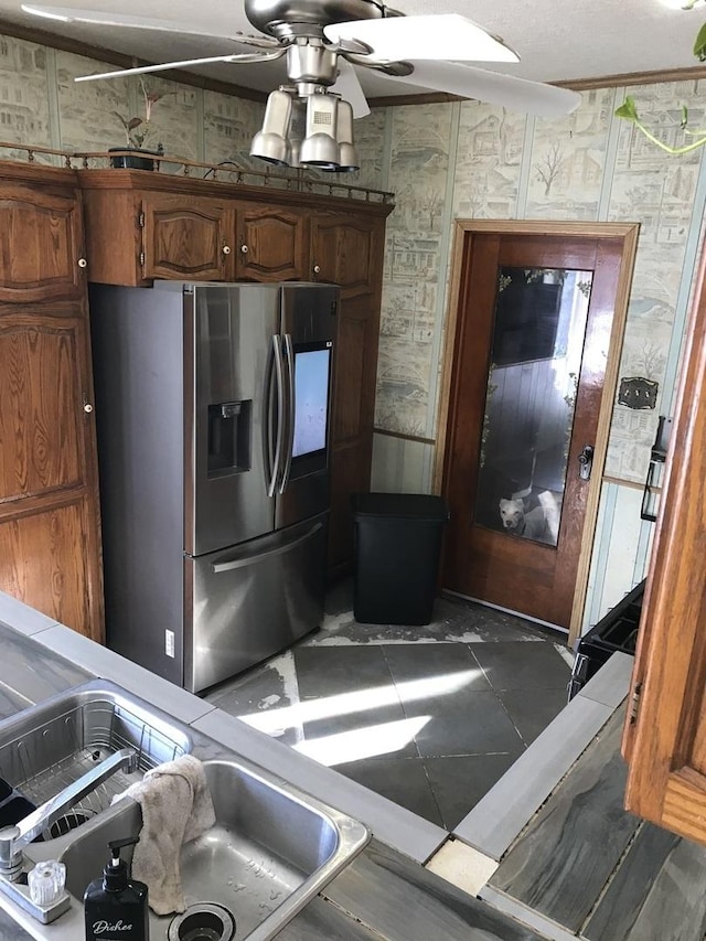 kitchen with stainless steel refrigerator with ice dispenser and ceiling fan