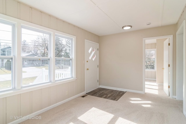 entryway featuring carpet flooring