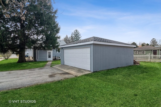 garage with a yard