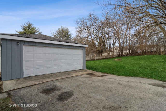 garage featuring a lawn