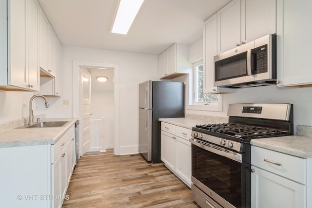 kitchen featuring white cabinetry and stainless steel appliances