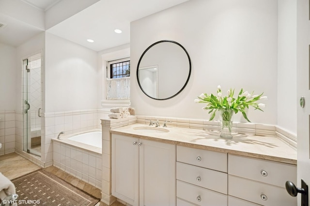 full bathroom featuring visible vents, tile patterned floors, a stall shower, a bath, and vanity