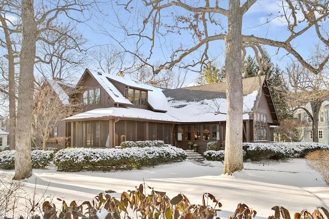 view of front of home featuring a sunroom