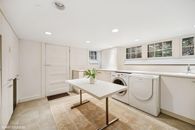 laundry room with independent washer and dryer, a sink, recessed lighting, light tile patterned flooring, and laundry area