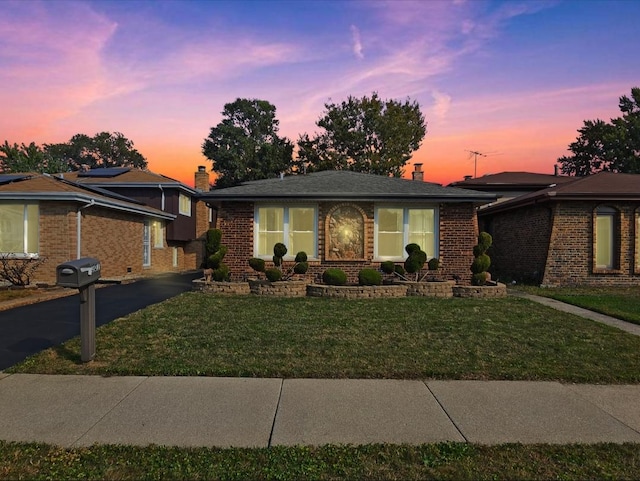 view of front of home featuring a yard