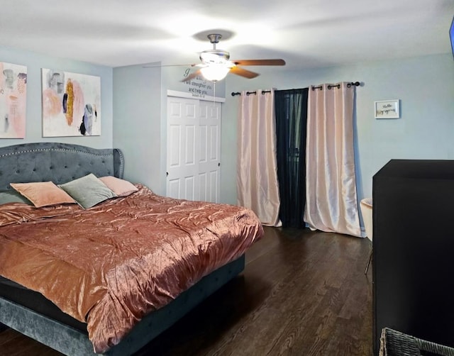 bedroom with ceiling fan and dark hardwood / wood-style flooring