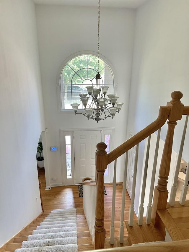 427 W Natoma Ave, Addison, IL 60101 - foyer entrance with a towering ceiling, stairs, light wood-style floors, and a chandelier