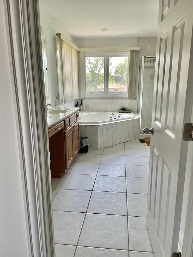 427 W Natoma Ave, Addison, IL 60101 - full bathroom featuring a garden tub, tile patterned flooring, vanity, and a stall shower