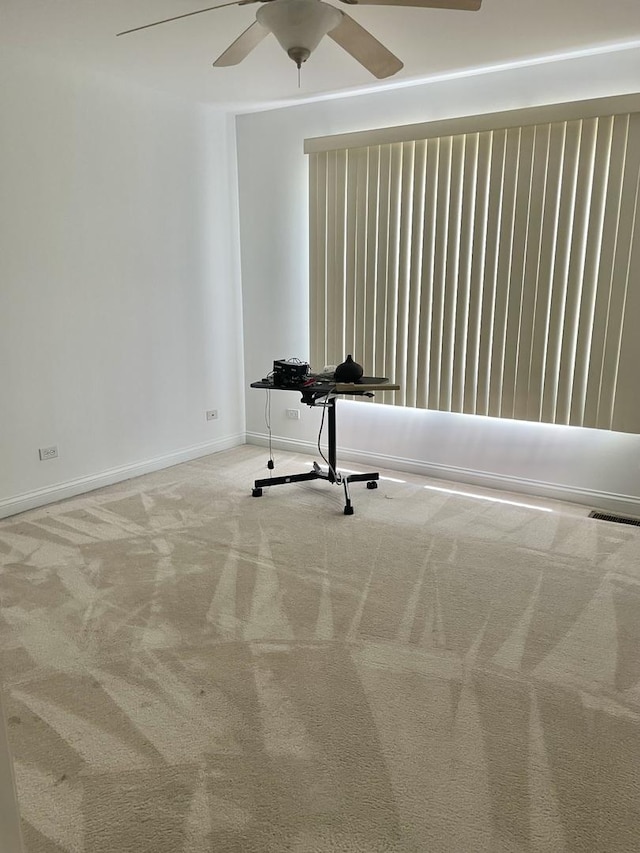 427 W Natoma Ave, Addison, IL 60101 - empty room with ceiling fan and carpet flooring
