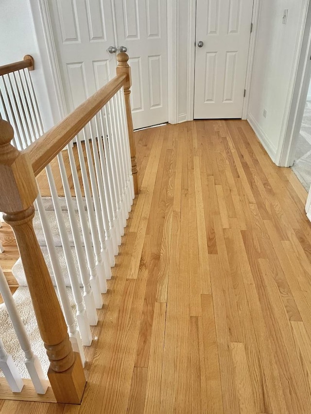 427 W Natoma Ave, Addison, IL 60101 - hallway featuring light wood-style floors and an upstairs landing