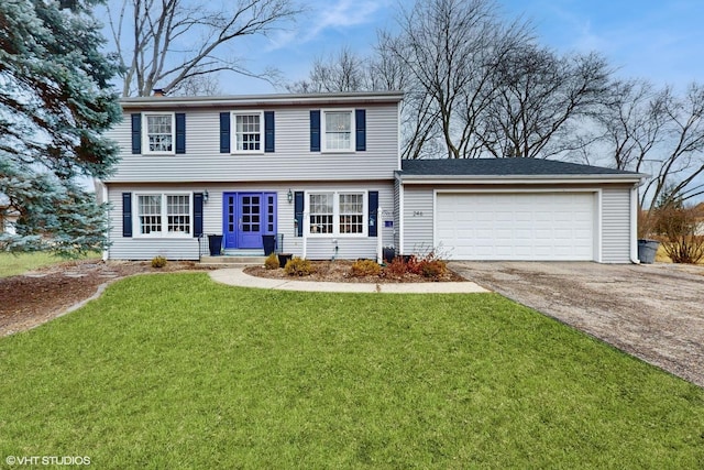 colonial-style house with a garage and a front lawn