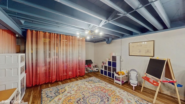 basement featuring dark hardwood / wood-style floors