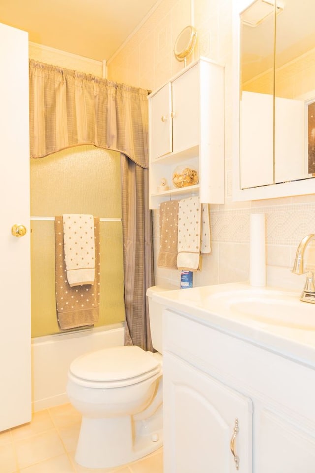 full bathroom featuring tasteful backsplash, tile patterned flooring, vanity, shower / tub combo, and toilet