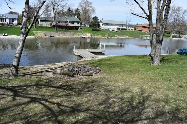 1407 Country Club Ln, Loda, IL 60948 - view of dock featuring a lawn, a residential view, and a water view