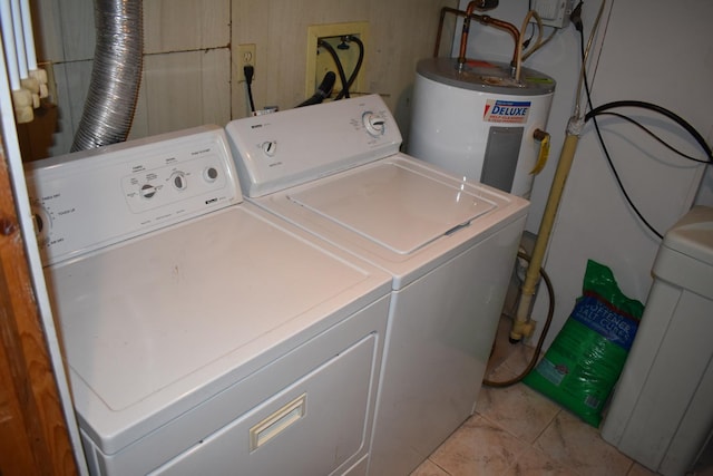 1407 Country Club Ln, Loda, IL 60948 - clothes washing area featuring electric water heater, light tile patterned floors, washing machine and clothes dryer, and laundry area
